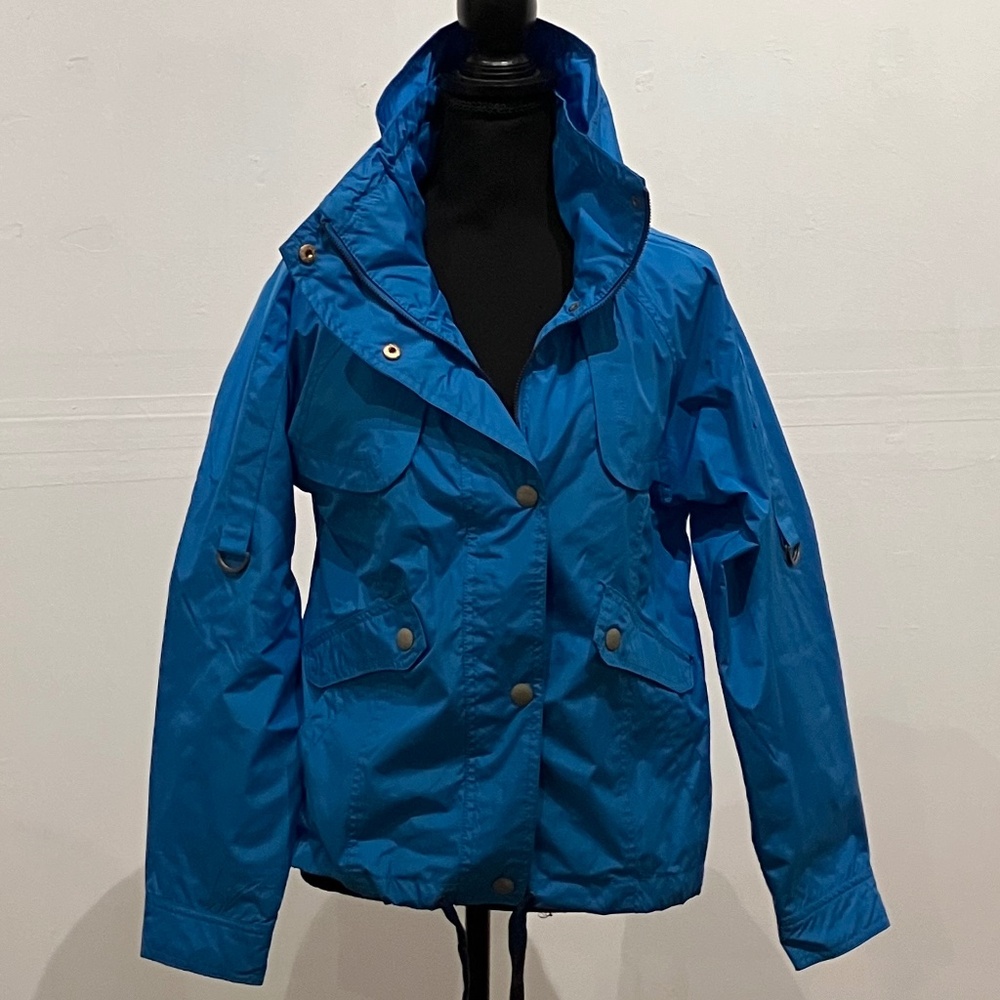 Pink envelopes, Crillion, blue windbreaker jacket